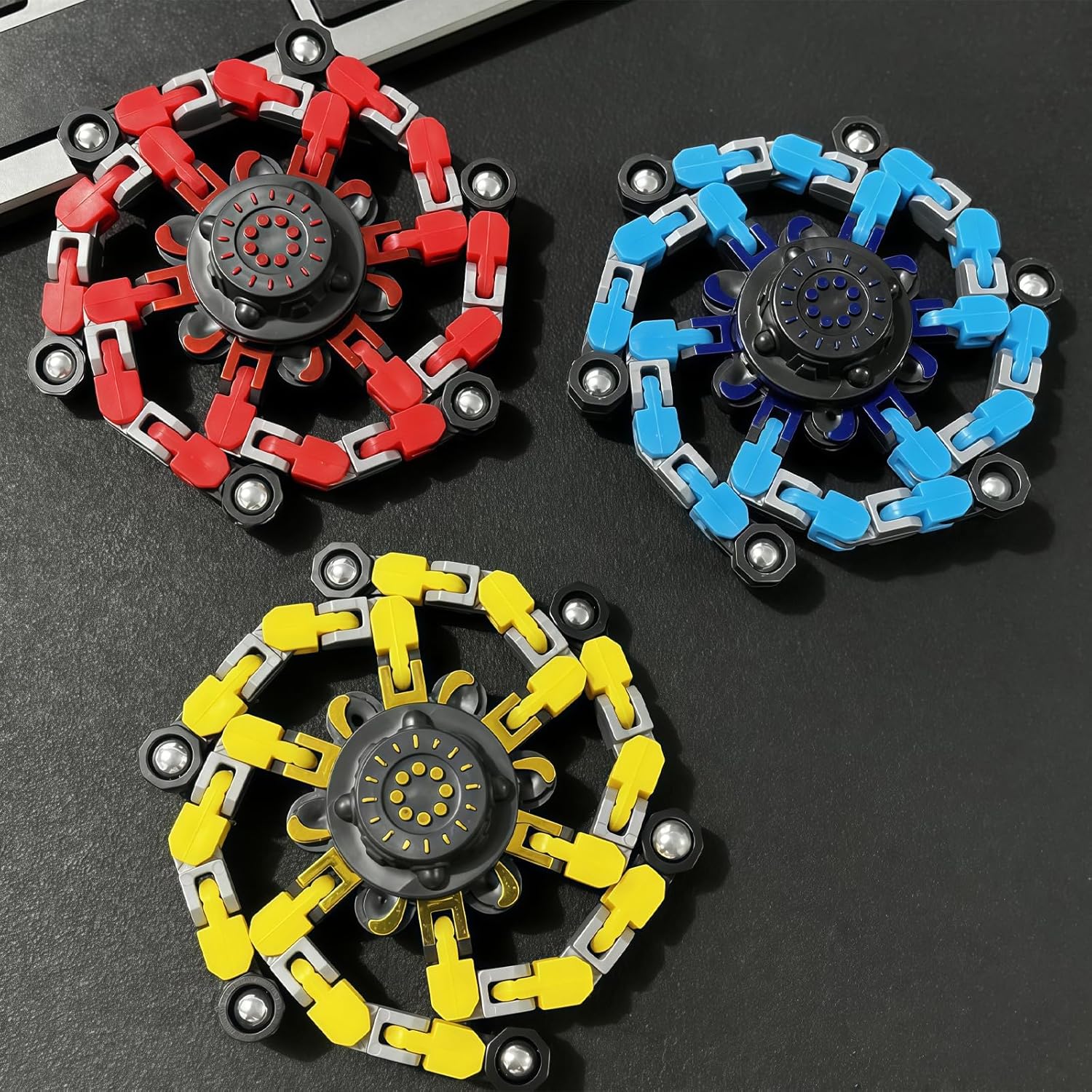 Chain-link fidget spinner configurations